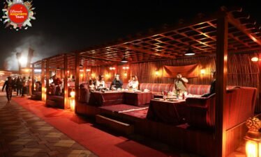 premium desert safari dubai camp interior majlis seating and soft lighting