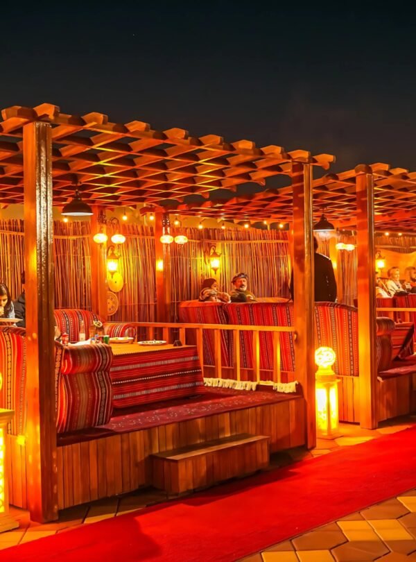 premium desert safari dubai camp interior majlis seating and soft lighting