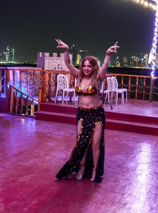 Guests enjoying live dance performance on dinner cruise